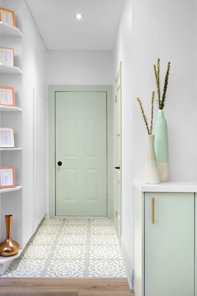 Mint colored front door with tile in front entryway by Michelle Berwick